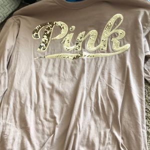 A pink Victoria’s Secret long sleeve shirt